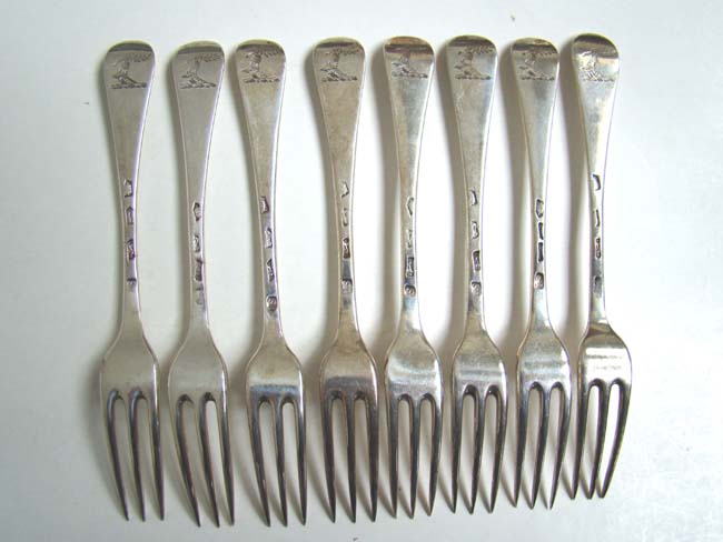 A nice set of four English sterling silver three-prong Dessert Forks by the maker I S or S I, London 1736